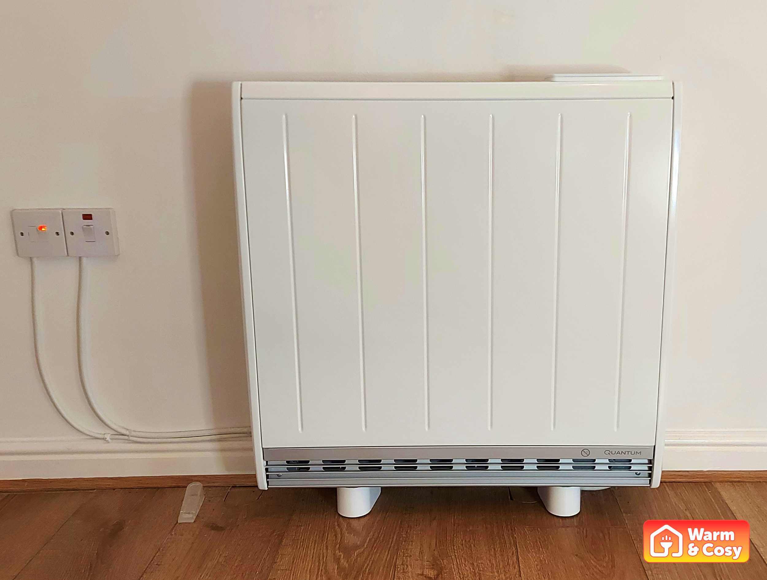 Front view of a Dimplex Quantum storage heater installed in a home, showcasing its modern design.