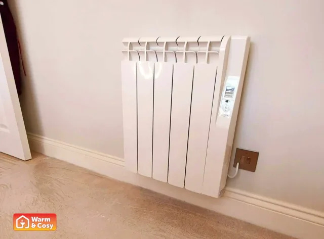 Original, undersized electric heater in a guest bedroom, before being upgraded by Warm & Cosy to a more efficient heating system.