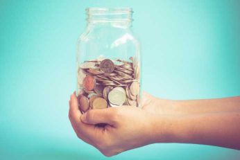 Jam jar full of coins